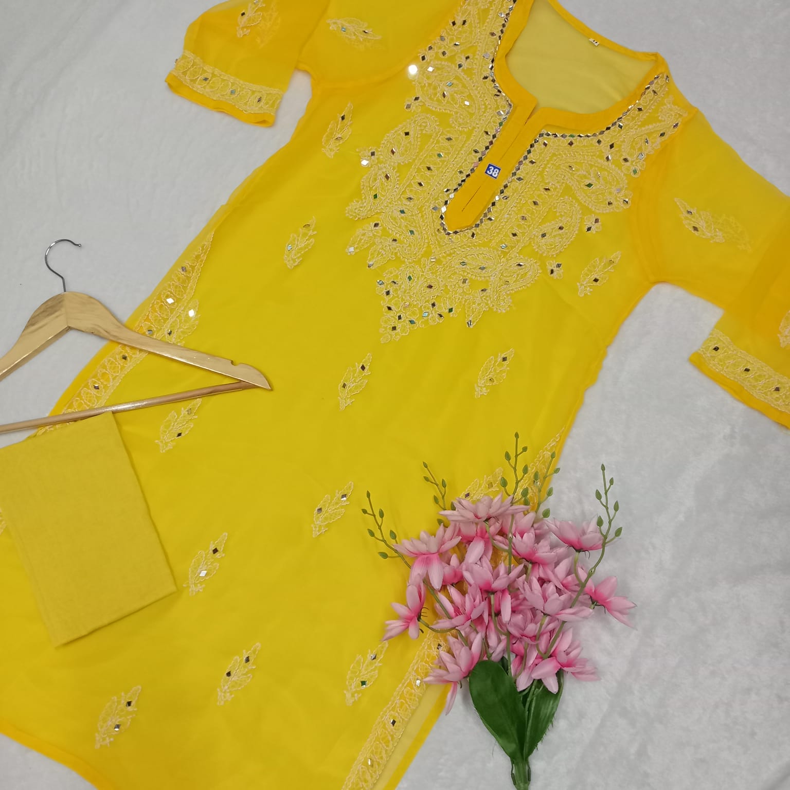 Buy Women Yellow Hankerchief Top With Mirror Work Online.